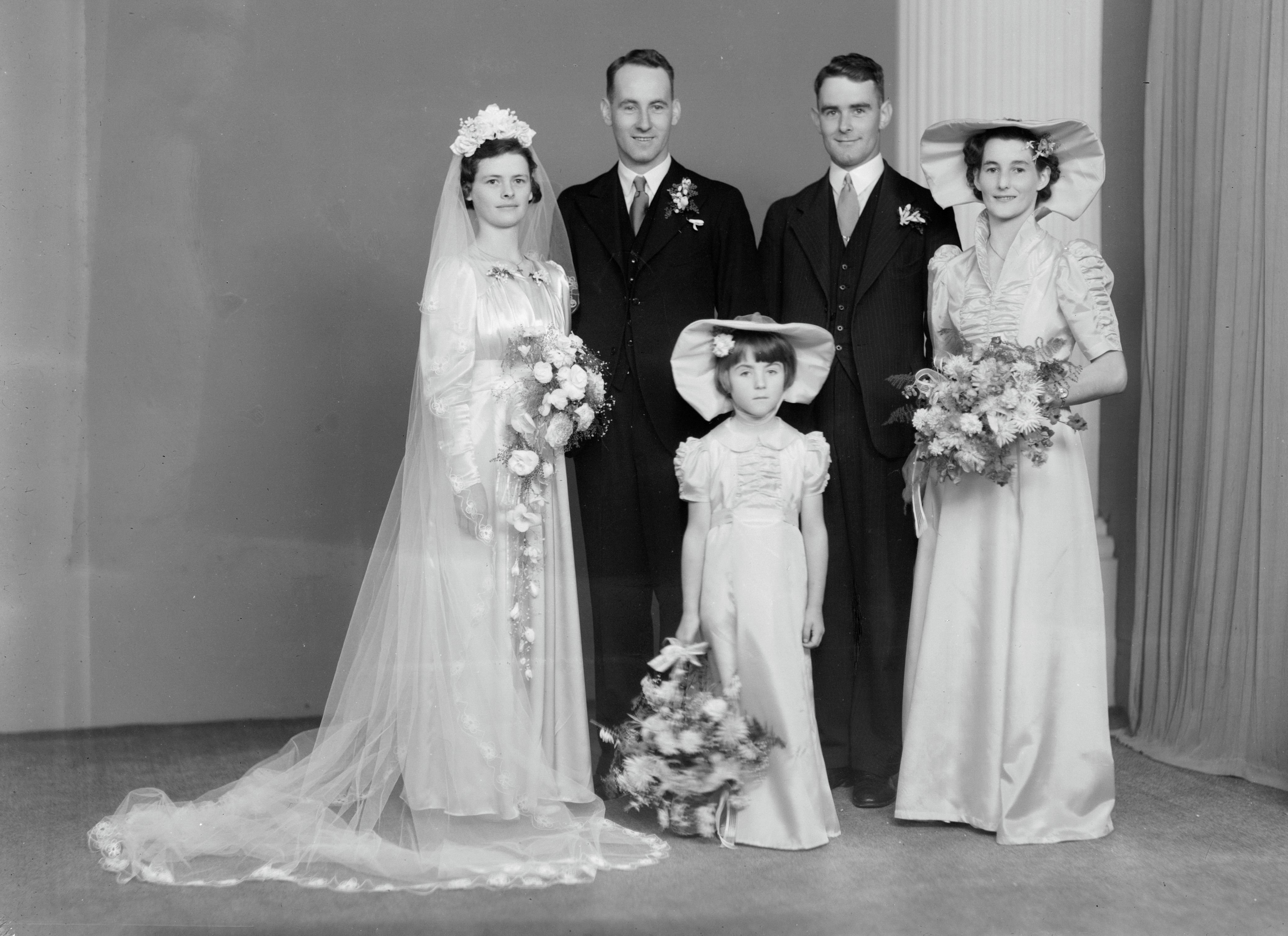 Marjorie Jensen and Patrick Bartle on their wedding day (9 February 1943). Swainson's Studios. Collection of Puke Ariki (WD.057531).