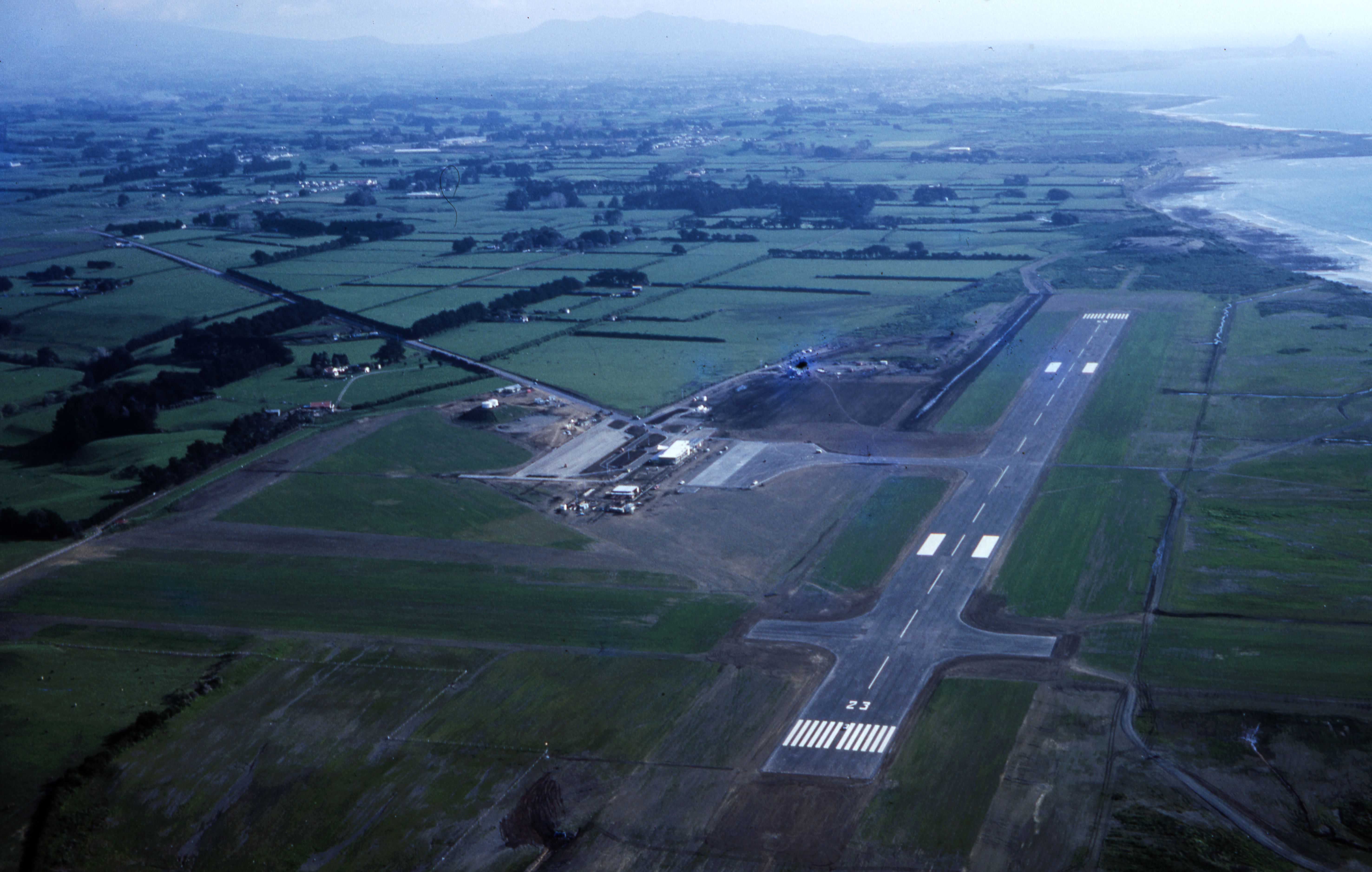 New Plymouth airport under construction in the 1960s with Brown Road on the left. Leslie Alexander Smith. Collection of Puke Ariki (PHO2015-0133).